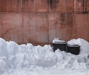 Snow covered wall against building