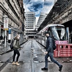 People walking on street in city