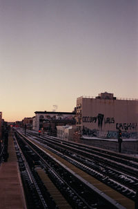 Railroad tracks against clear sky