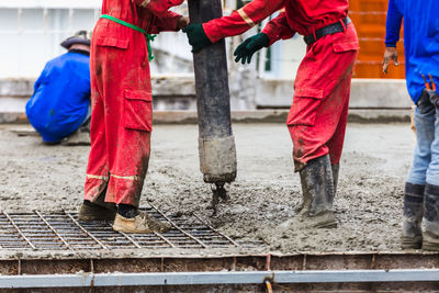 Low section of man working at construction site