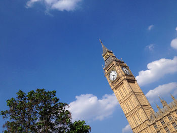 Low angle view of building against blue sky