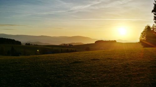 Scenic view of landscape at sunset