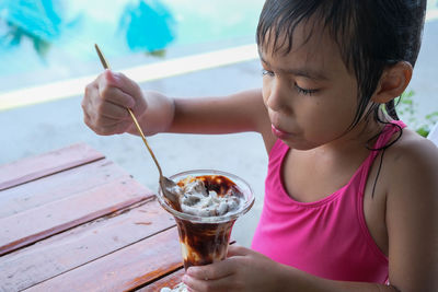 Close-up of woman holding drink