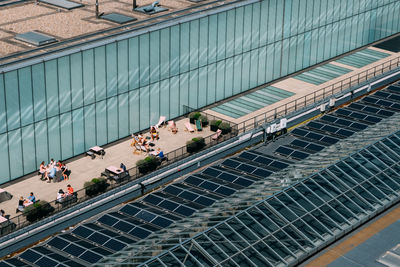 High angle view of people on street in city during sunny day