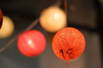 Close-up of illuminated lanterns hanging