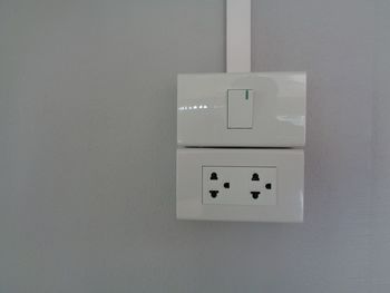 Close-up of electric lamp on wall