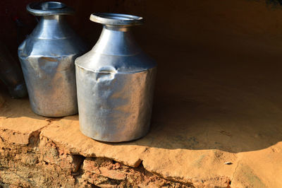Milk containers on footpath
