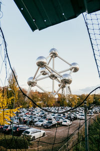 Close-up of ferris wheel against sky