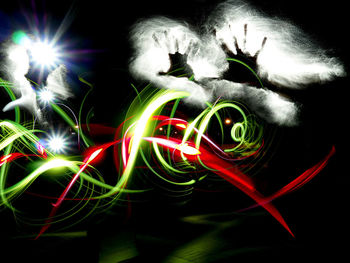 Close-up of light trails against black background