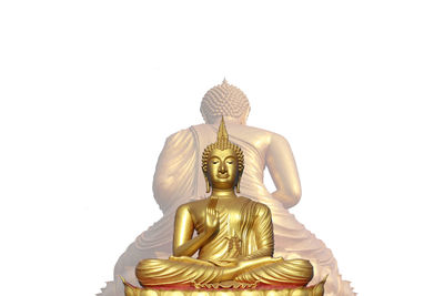 Statue of buddha against white background