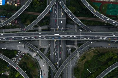 Aerial view of bridge over road in city