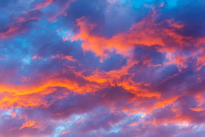 Low angle view of dramatic sky during sunset