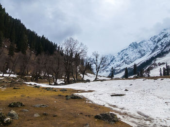 Scenic view of snowcapped mountains against sky