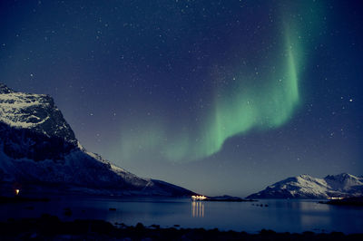 Scenic view of mountains against sky at night