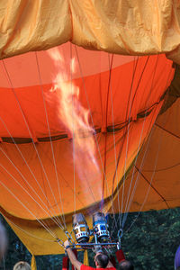 Man lighting hot air balloon