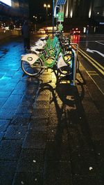 Cars parked on road at night