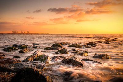 Scenic view of sea against sky during sunset