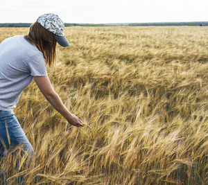 Rear view of man working at farm