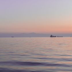 Scenic view of sea against sky at sunset