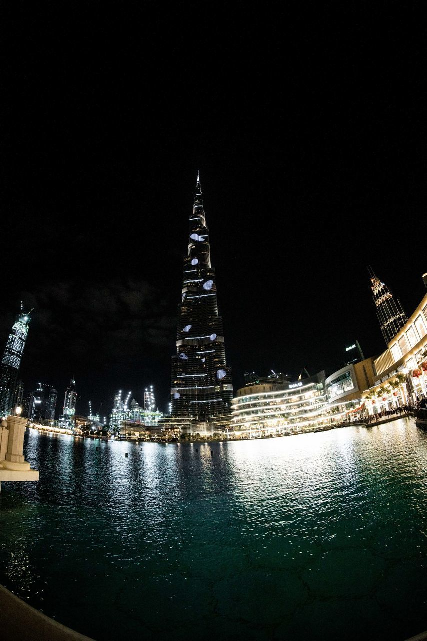 ILLUMINATED BUILDINGS AT NIGHT