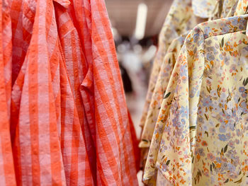 Close-up of clothes hanging for sale