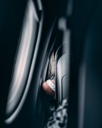 Rear view of woman sitting at airplane