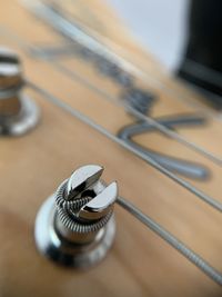 Close-up of guitar on table