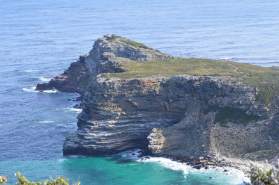 Close-up of rocky cliff by sea