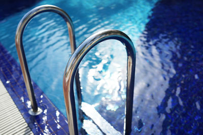 High angle view of ladder on swimming pool