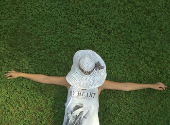 High angle view of woman wearing hat on field