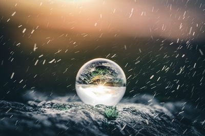 Close-up of water splashing on glass