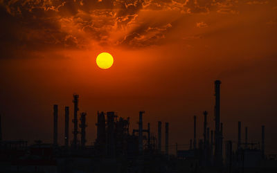 Sunrise over an oil refinery port south of kuwait city