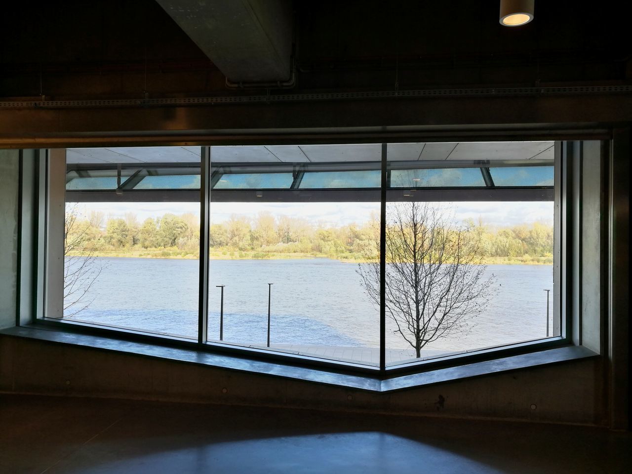 window, indoors, water, no people, day, tree, river, nature, architecture, built structure, sky, scenics, beauty in nature