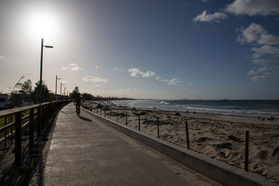 Street by sea against sky