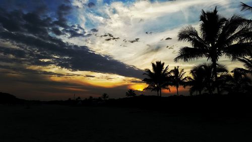 Silhouette trees against sky during sunset