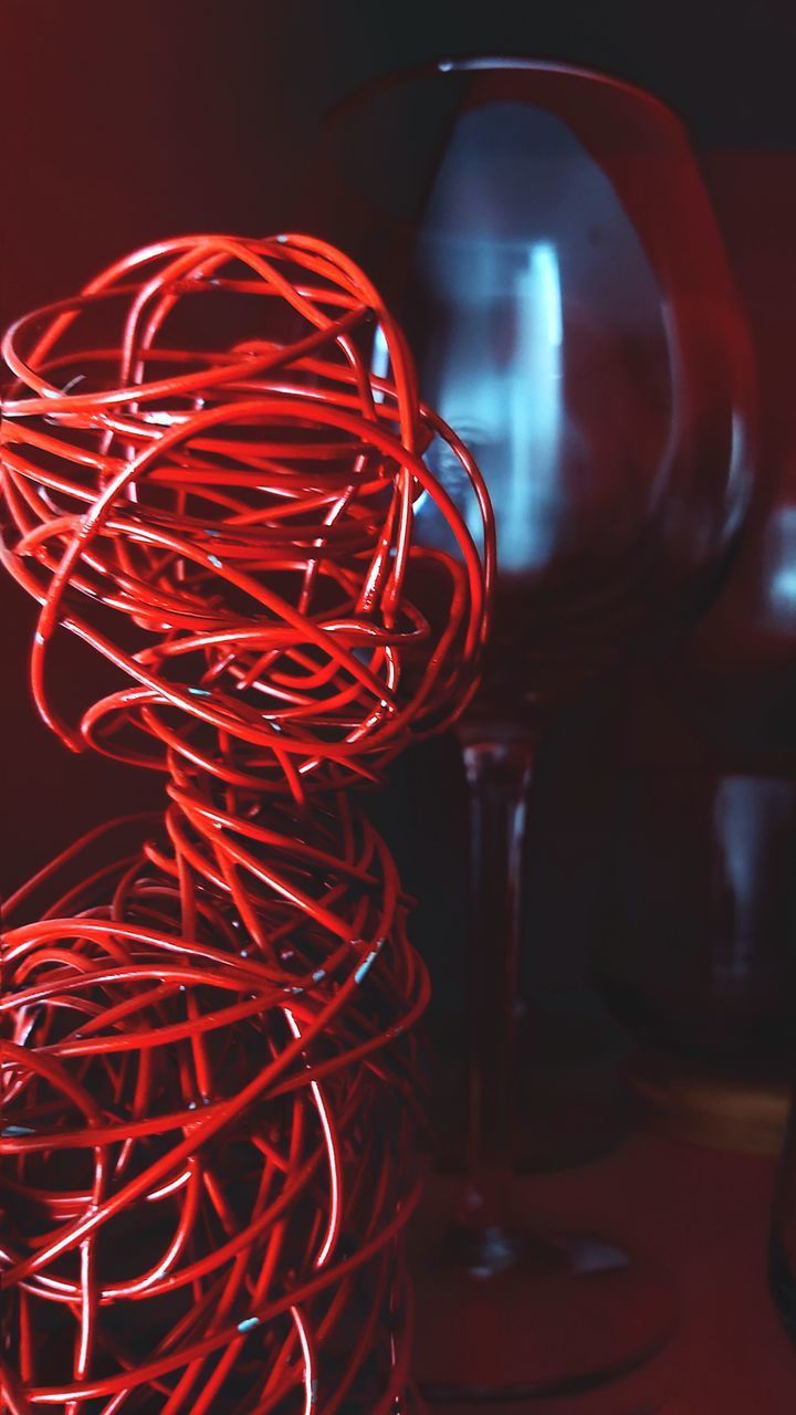 CLOSE-UP OF ILLUMINATED RED TABLE