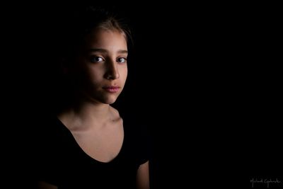 Portrait of young woman at night