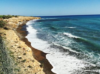 Scenic view of sea against blue sky