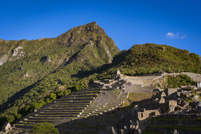 High angle view of mountain against blue sky