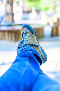 Low section of person relaxing outdoors