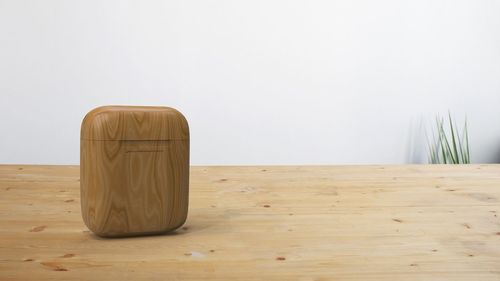 Close-up of wooden table against white background