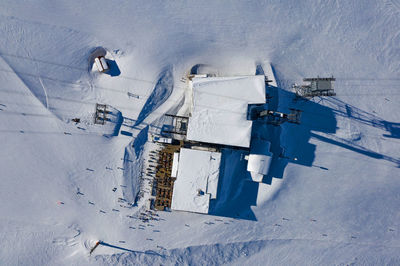 High angle view of cars on snow covered field