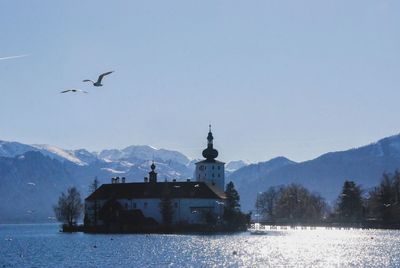 Scenic view of sea against clear blue sky