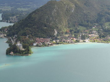 Scenic view of sea and buildings in city