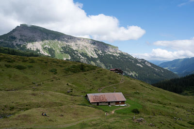 Scenic view of landscape and mountains against sky