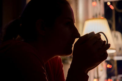 Close-up of woman drinking coffee