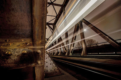 Railroad tracks in city against sky