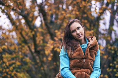 Portrait of young woman during autumn