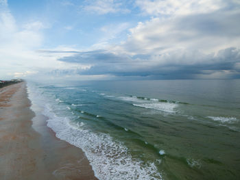 Sunrise at ormond beach florida as a storm approaches the coast