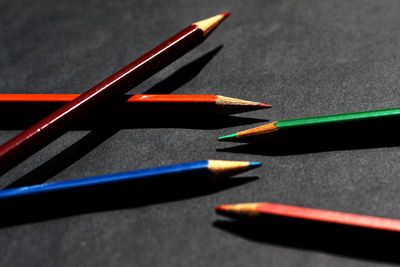 Close-up of colored pencils on table